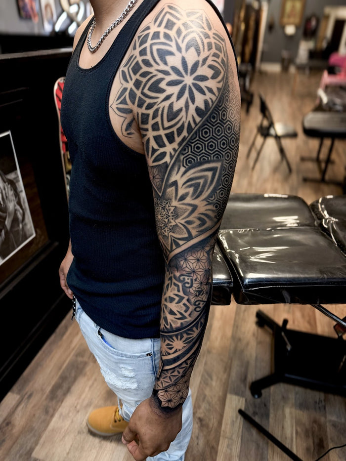 Full mandala and geometric sleeve tattoo by Austina Obscure